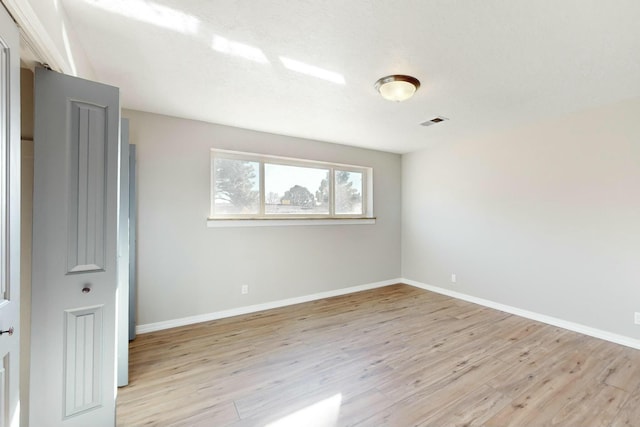 unfurnished bedroom featuring light hardwood / wood-style floors