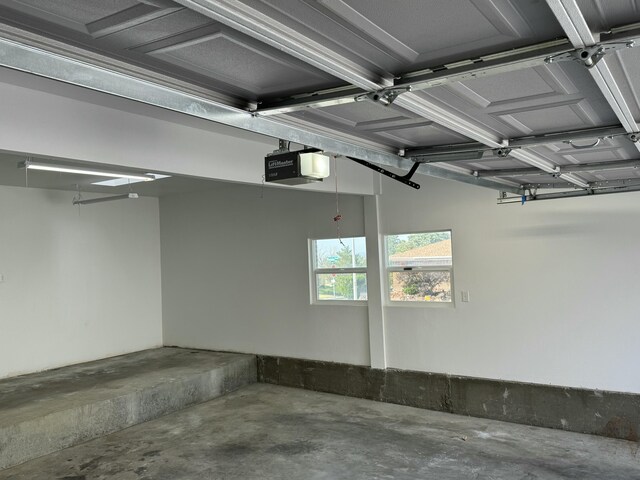 spare room with electric panel and light wood-type flooring