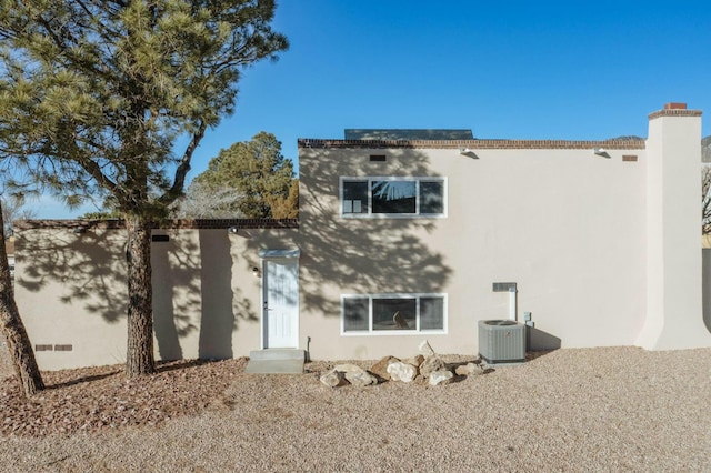 view of front of house featuring cooling unit