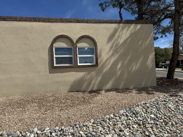 view of side of property with a patio