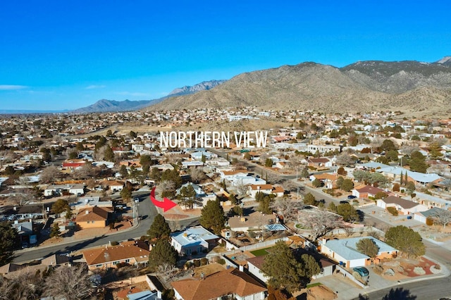 birds eye view of property featuring a mountain view