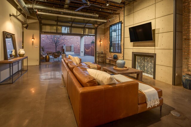 home theater featuring a high ceiling and a fireplace