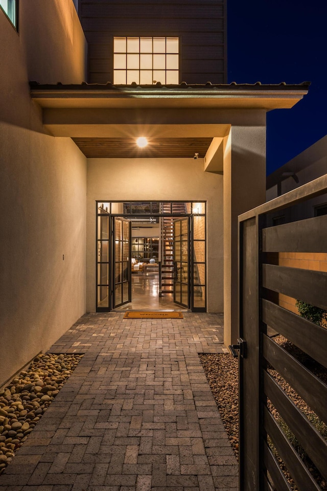 exterior entry at twilight with a patio