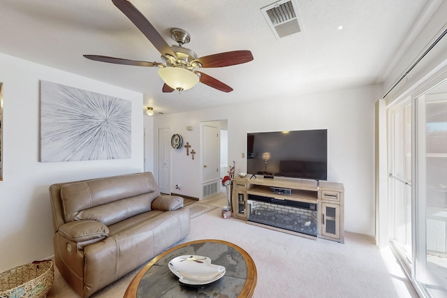 living room featuring ceiling fan and light carpet