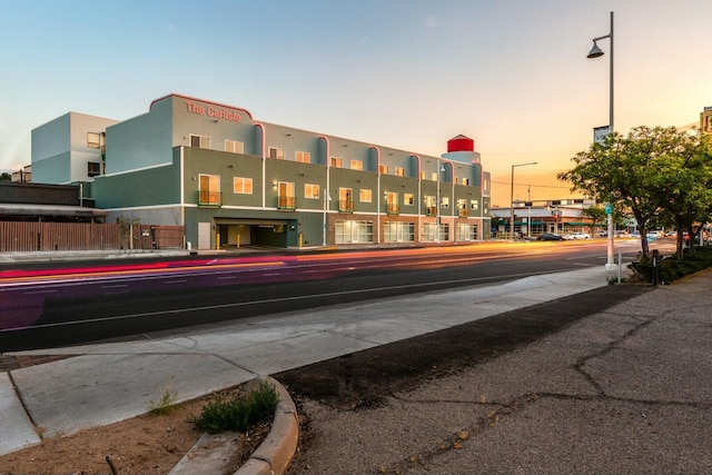 view of outdoor building at dusk