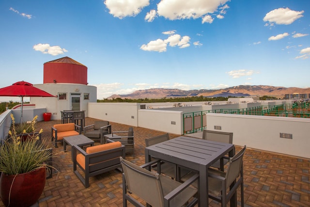 view of patio featuring outdoor lounge area and a mountain view