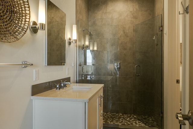 bathroom with vanity and an enclosed shower