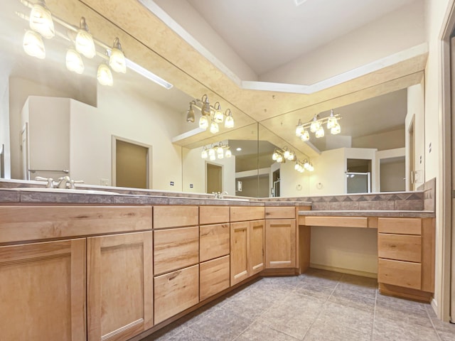 bathroom with tile patterned floors and vanity