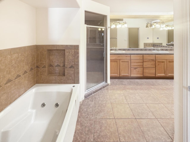 bathroom featuring vanity, tile patterned flooring, and shower with separate bathtub