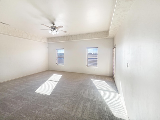 carpeted empty room with ceiling fan