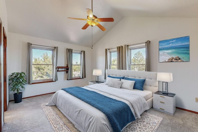 carpeted bedroom featuring lofted ceiling and ceiling fan