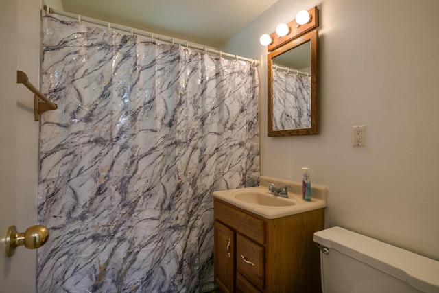 bathroom with vanity, a shower with curtain, and toilet