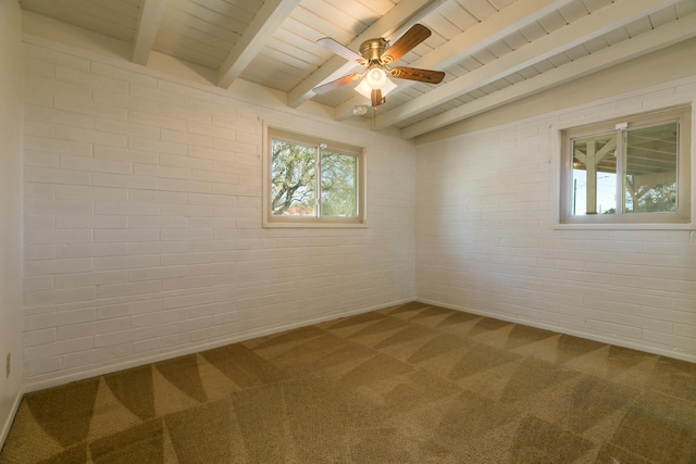 carpeted empty room with beamed ceiling, ceiling fan, brick wall, and wooden ceiling