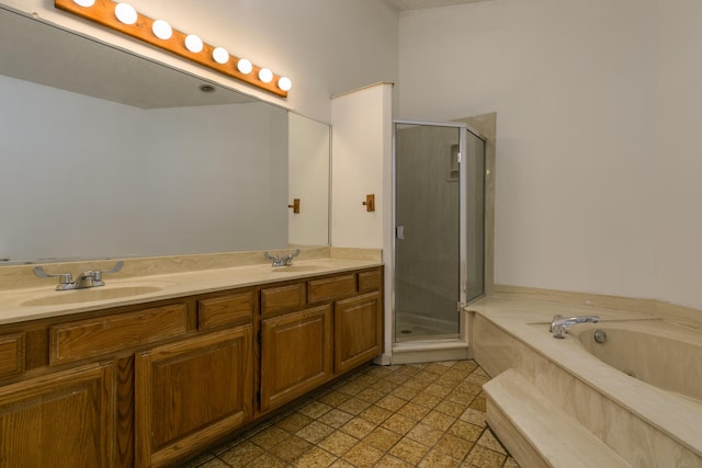 bathroom featuring independent shower and bath and vanity