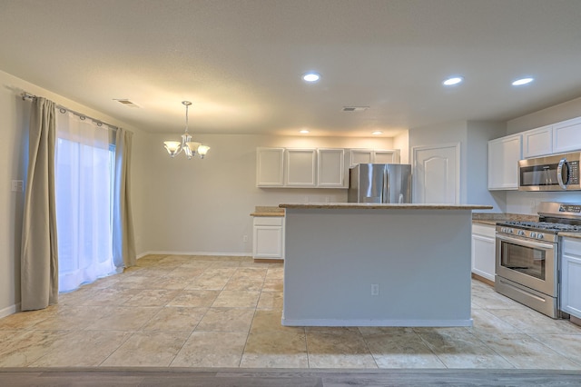 kitchen with white cabinetry, an inviting chandelier, decorative light fixtures, a center island, and stainless steel appliances