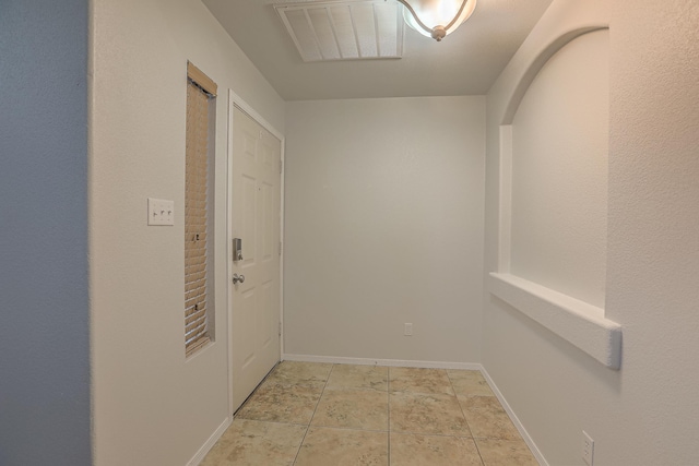 interior space with light tile patterned floors