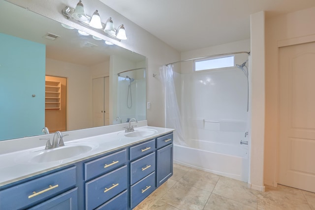 bathroom featuring tile patterned flooring, vanity, and shower / bathtub combination with curtain