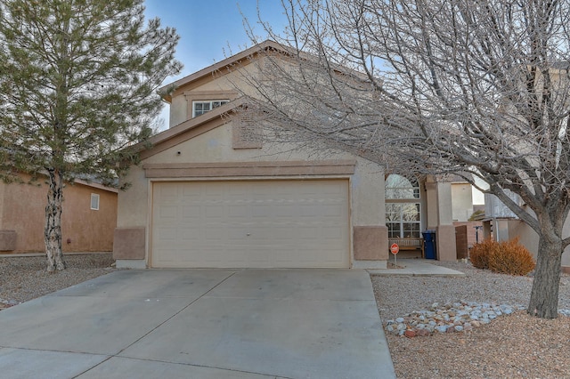 front of property featuring a garage and central air condition unit