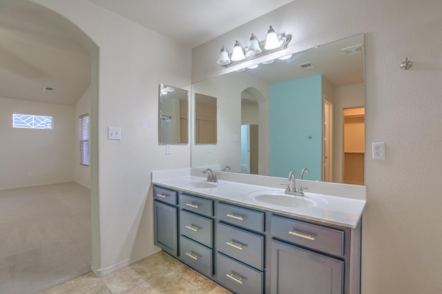 bathroom featuring tile patterned flooring and vanity