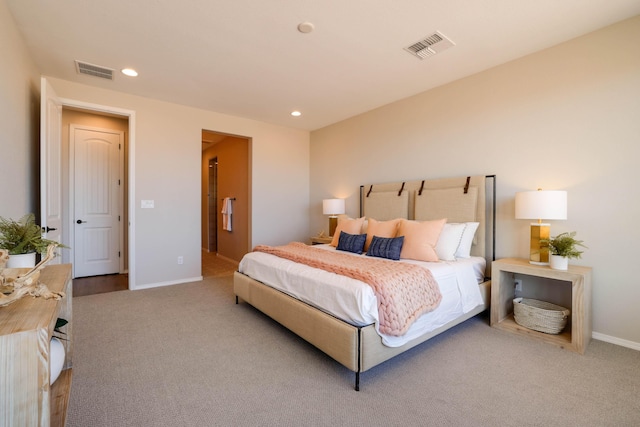 bedroom with light carpet, visible vents, and recessed lighting