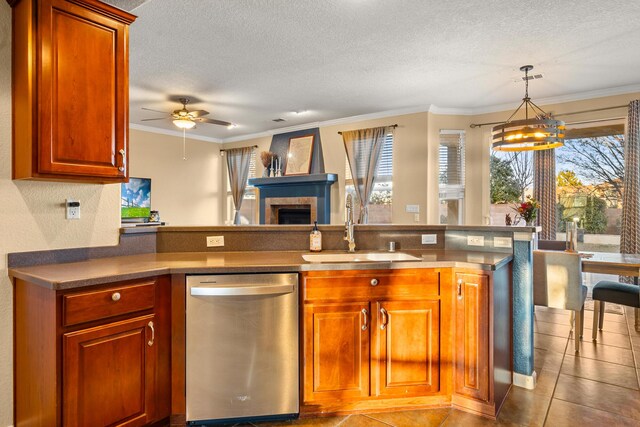 kitchen featuring sink, crown molding, a wealth of natural light, and dishwasher