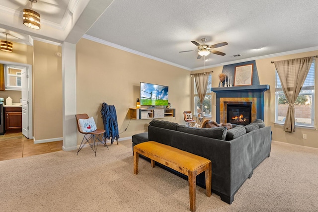 living room with ornamental molding, light colored carpet, and plenty of natural light