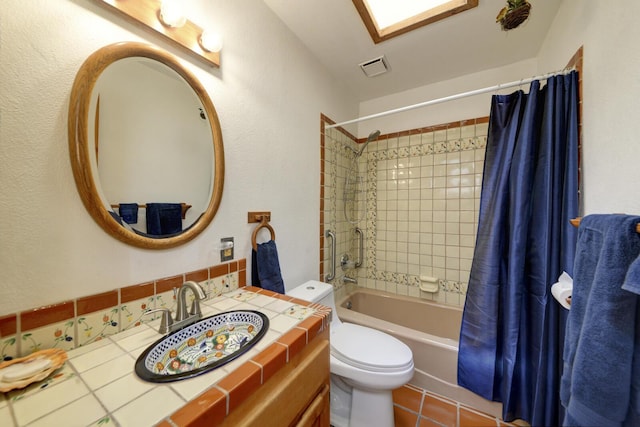 full bathroom with toilet, tile patterned flooring, shower / bath combination with curtain, vanity, and backsplash