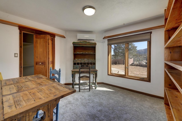 interior space featuring a wall mounted air conditioner and carpet floors