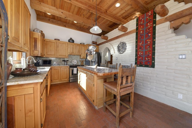 kitchen with wooden ceiling, a center island, brick wall, beamed ceiling, and stainless steel appliances