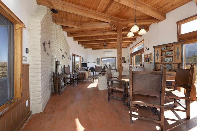 dining room with wood ceiling, beamed ceiling, and a wealth of natural light