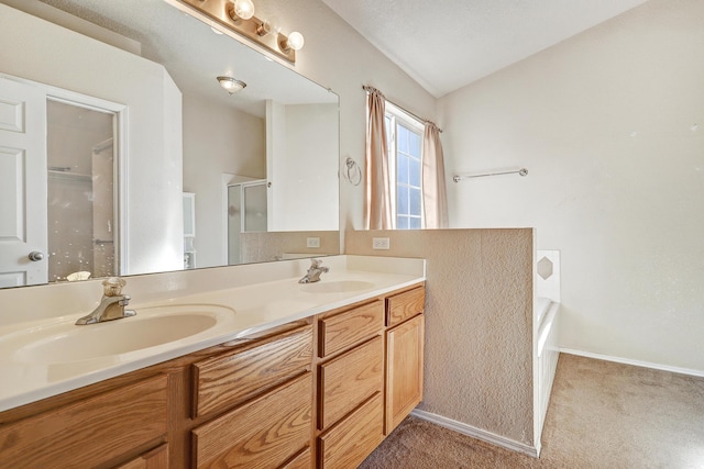 bathroom featuring vanity, vaulted ceiling, and shower with separate bathtub