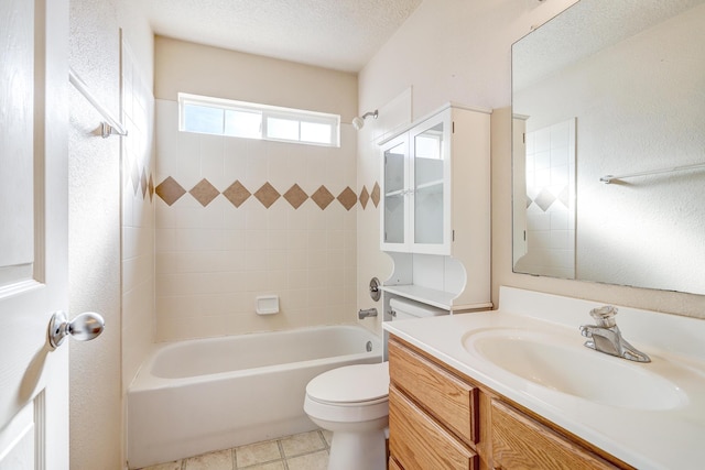 full bathroom featuring shower / bathtub combination, toilet, a textured ceiling, and vanity