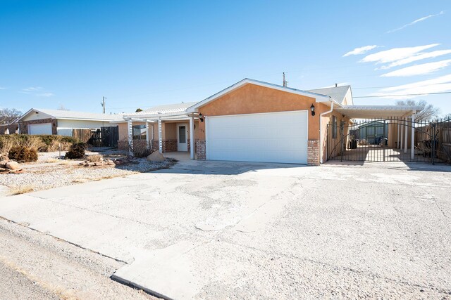 809 Kingman Ave, Grants, NM 87020 - ranch-style home with fence, driveway, and a garage