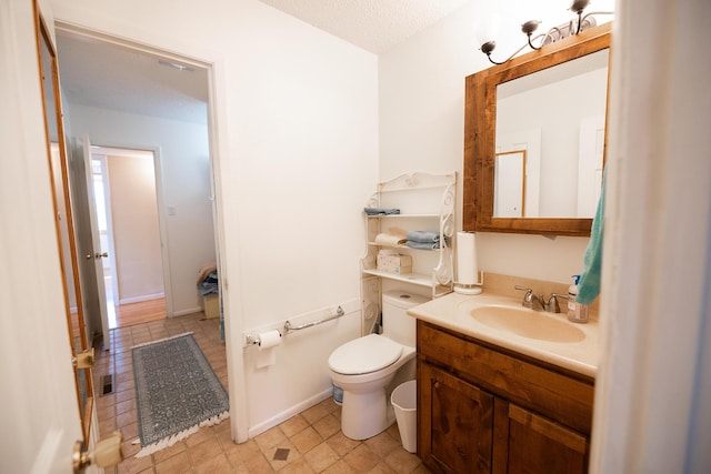 809 Kingman Ave, Grants, NM 87020 - half bathroom with vanity, toilet, visible vents, and tile patterned flooring