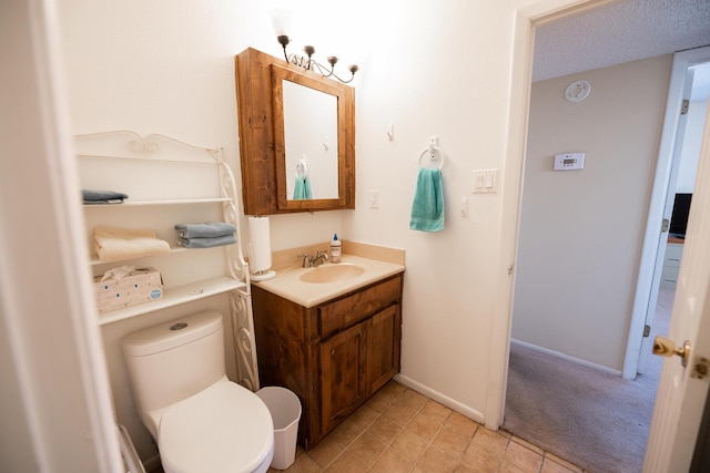 809 Kingman Ave, Grants, NM 87020 - bathroom with tile patterned floors, vanity, toilet, and baseboards