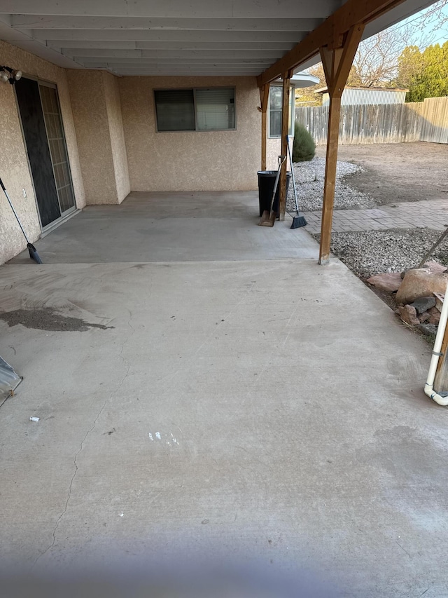 809 Kingman Ave, Grants, NM 87020 - view of patio featuring fence and a carport