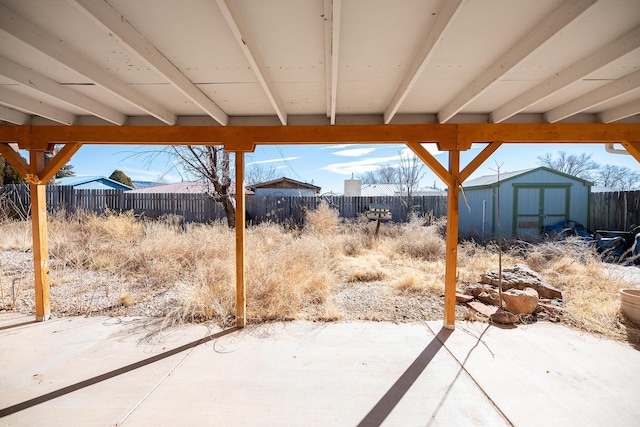 809 Kingman Ave, Grants, NM 87020 - view of patio / terrace featuring a storage shed, an outdoor structure, and a fenced backyard