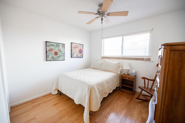 809 Kingman Ave, Grants, NM 87020 - bedroom with baseboards, ceiling fan, and light wood finished floors