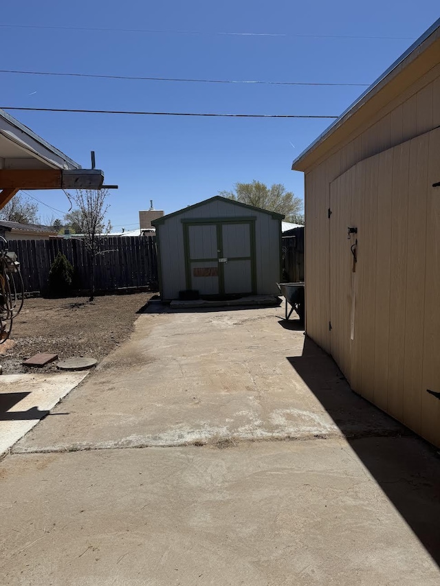 809 Kingman Ave, Grants, NM 87020 - exterior space with fence, a shed, and an outbuilding