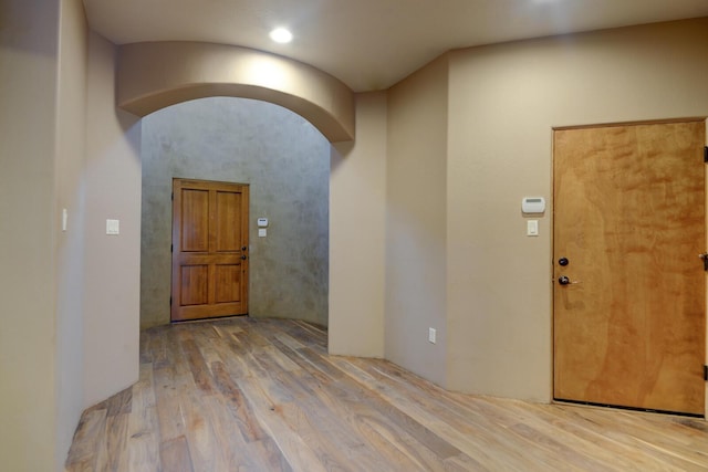 foyer entrance with light hardwood / wood-style flooring