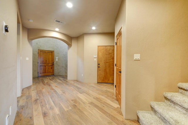 corridor featuring light hardwood / wood-style floors