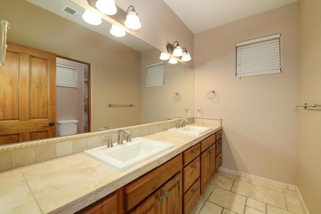 bathroom with vanity and toilet