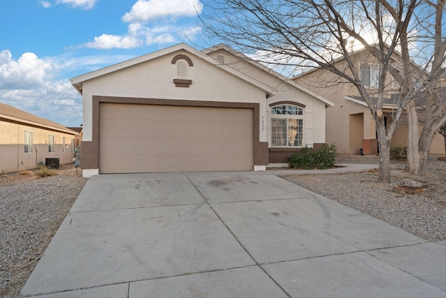 ranch-style house with cooling unit and a garage