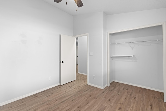 unfurnished bedroom with ceiling fan, a closet, and light hardwood / wood-style flooring