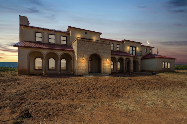 mediterranean / spanish-style house with a balcony