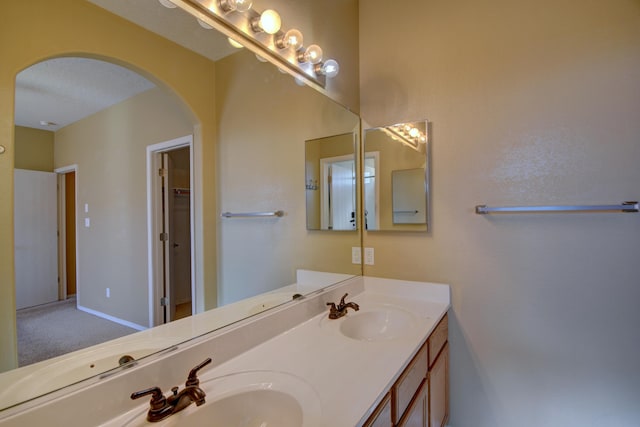 bathroom with vanity and a textured ceiling