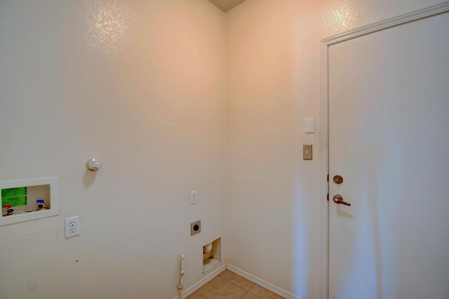 laundry room featuring gas dryer hookup, washer hookup, light tile patterned floors, and electric dryer hookup