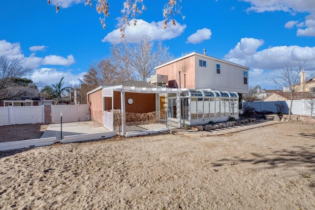 back of property featuring a wooden deck