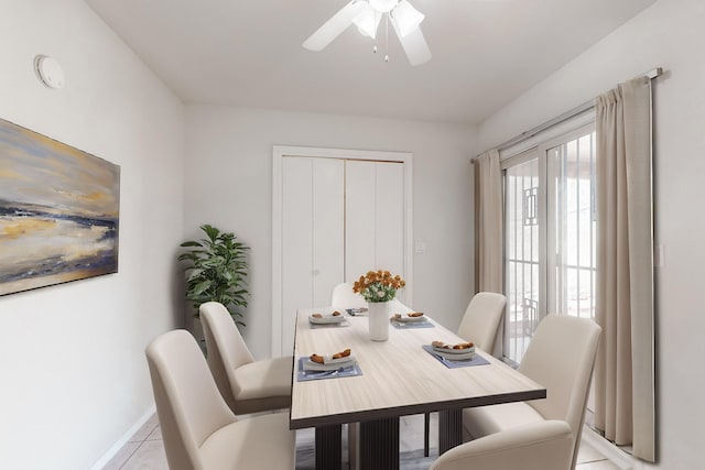 dining area featuring ceiling fan and light tile patterned floors