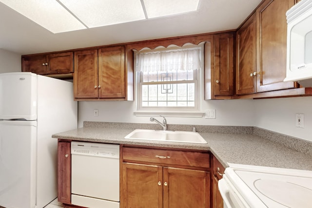 kitchen with white appliances and sink